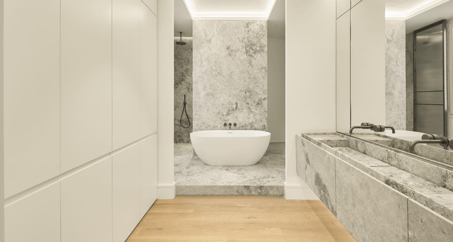 Pavimento, aplacado y mueble lavabo en mármol London Grey.